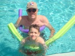 Derek and grandpa having fun at the pool.
